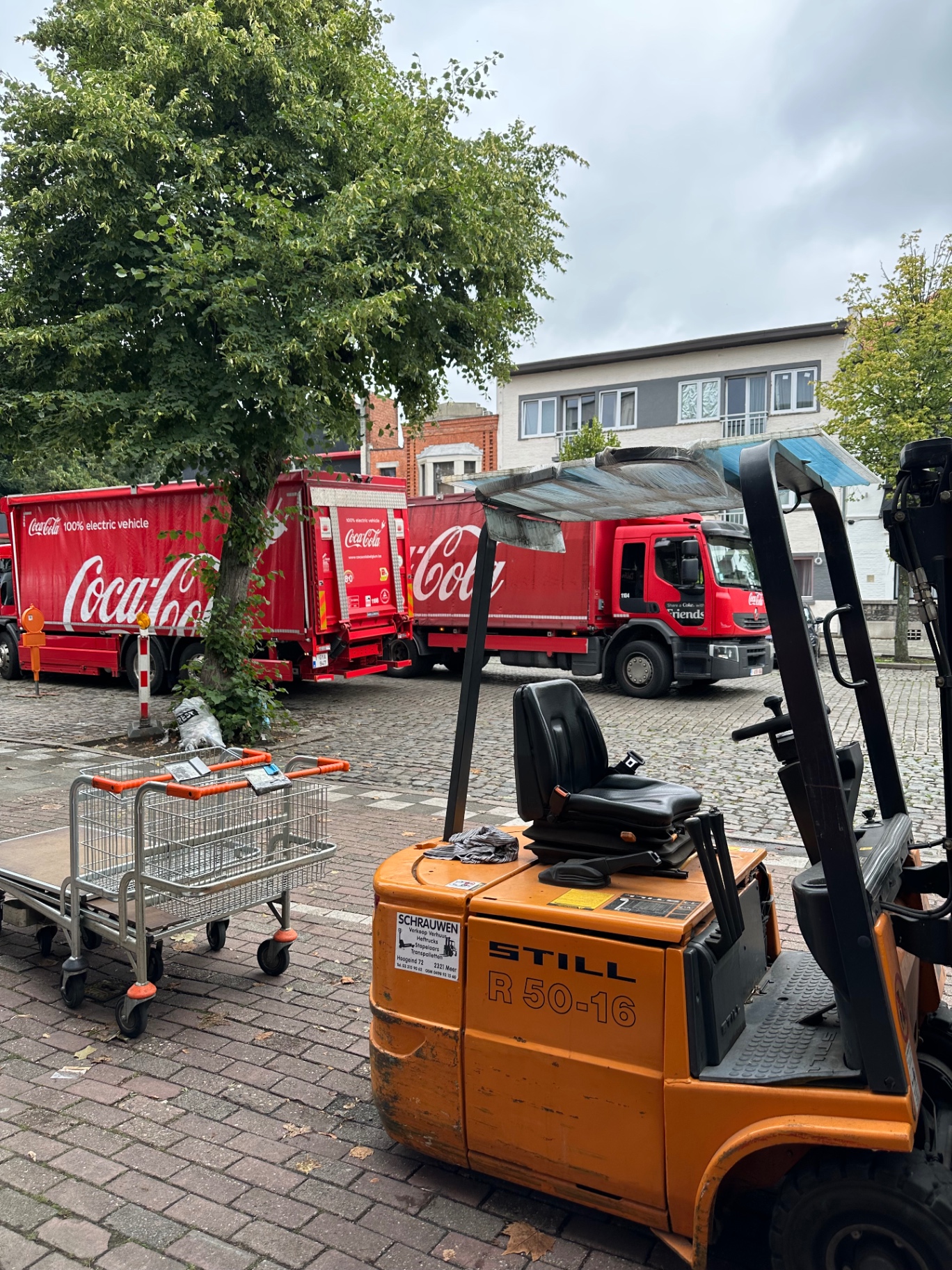 Forklift and Coca-Cola delivery trucks during Mix Drink BV dispatch activity